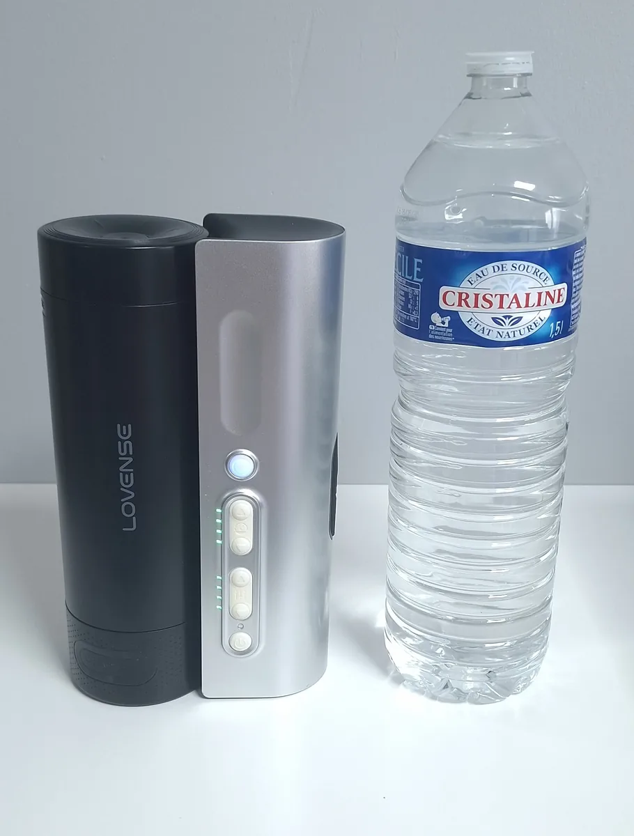 The Lovense Solace Pro next to a 1.5 L (0.4 US gal) water bottle for scale